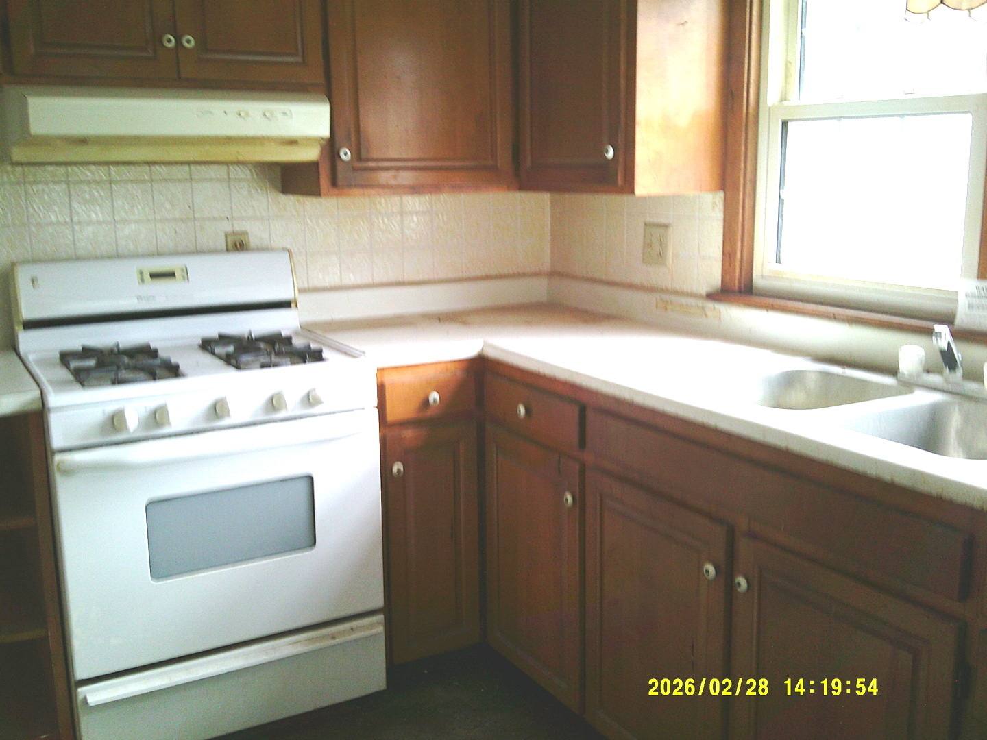 409 McKillop Street Lynn Center, IL 61262 - Photo 6 of 19 a kitchen with a stove and cabinets