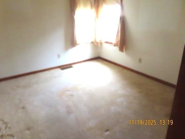 409 McKillop Street Lynn Center, IL 61262 - Photo 9 of 19 an empty room with a window