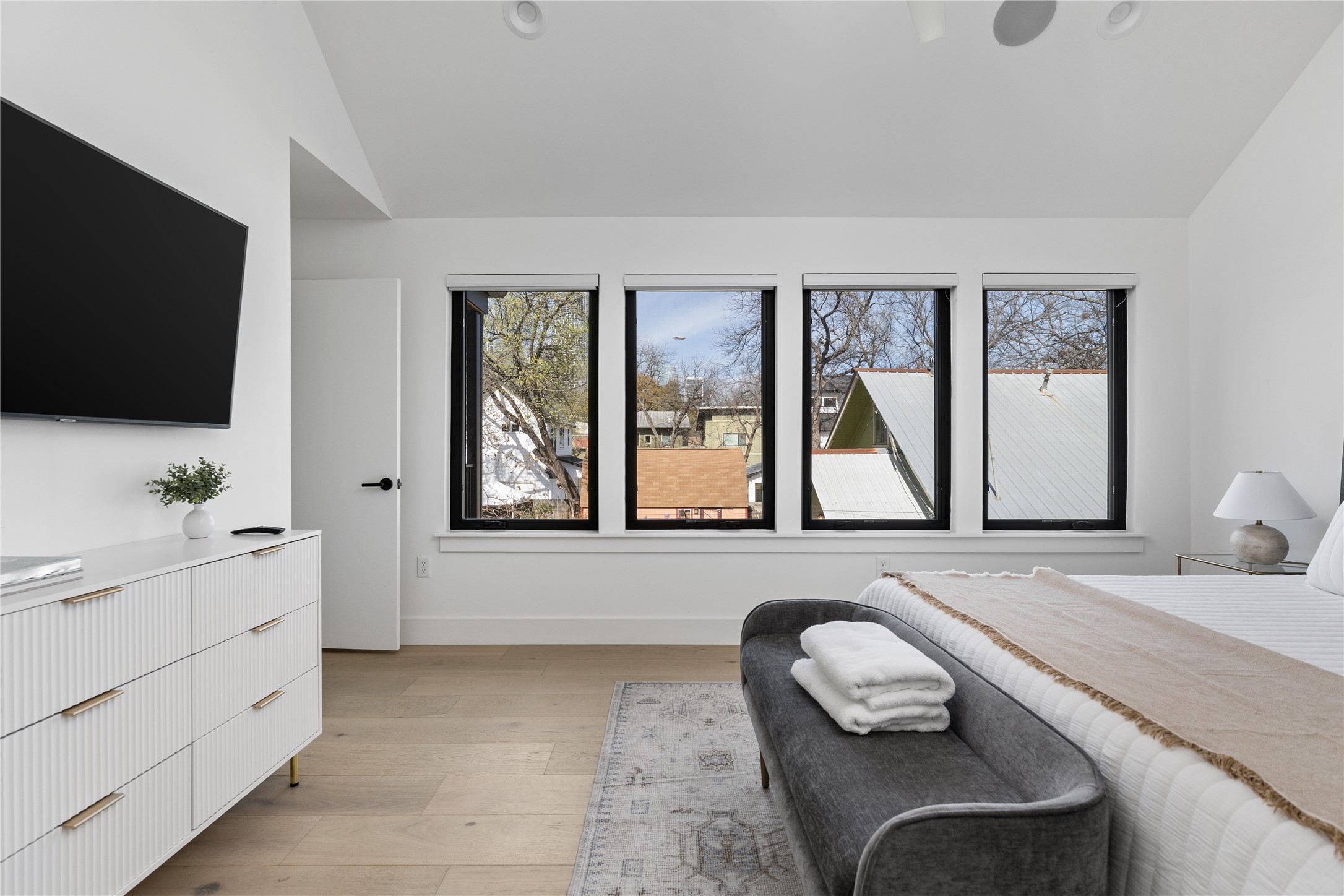 108 Comal Street Austin, TX 78702 - Photo 14 of 40 Bedroom with vaulted ceiling and light wood finished floors