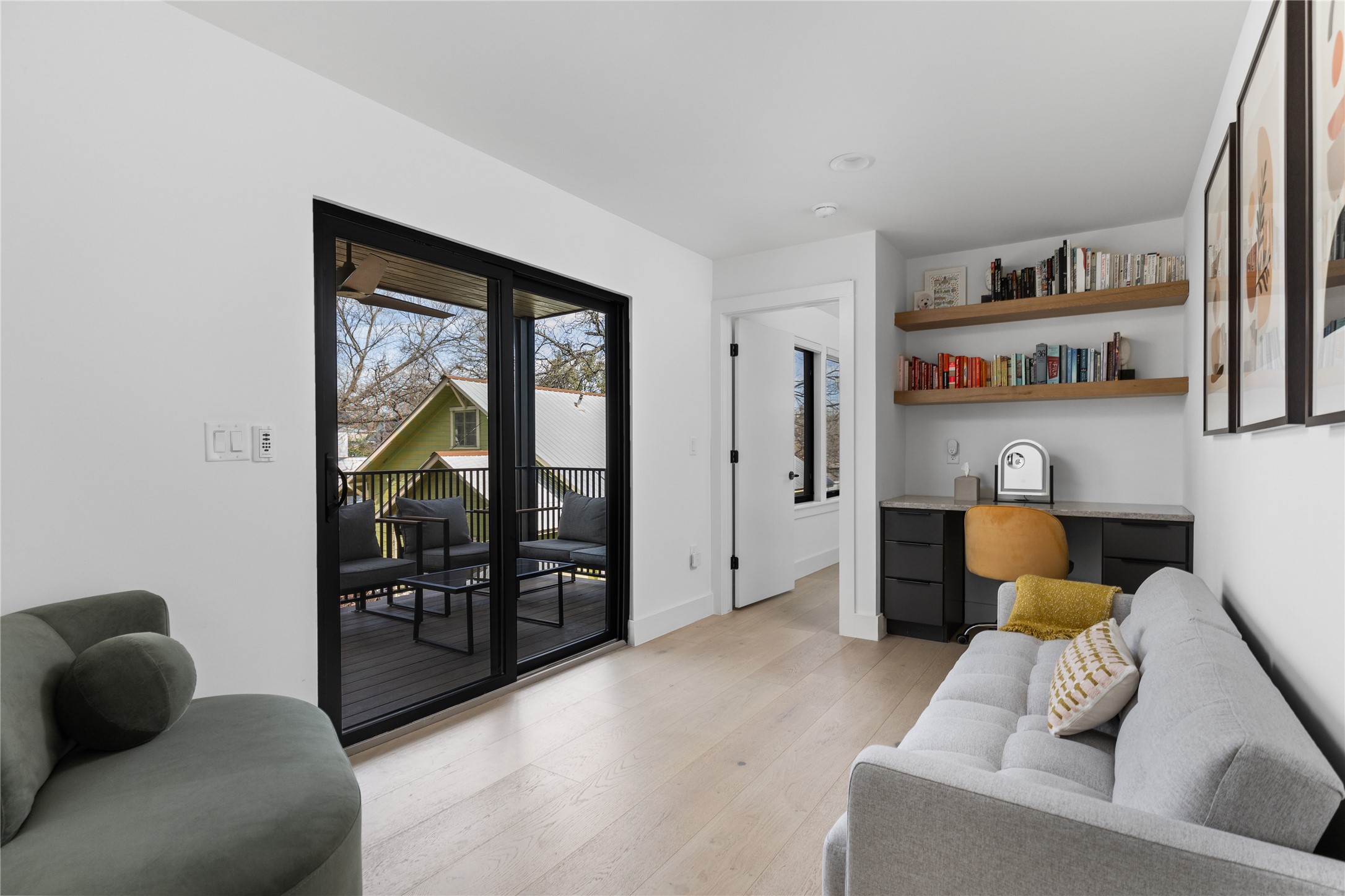 108 Comal Street Austin, TX 78702 - Photo 20 of 40 a living room with furniture and a floor to ceiling window