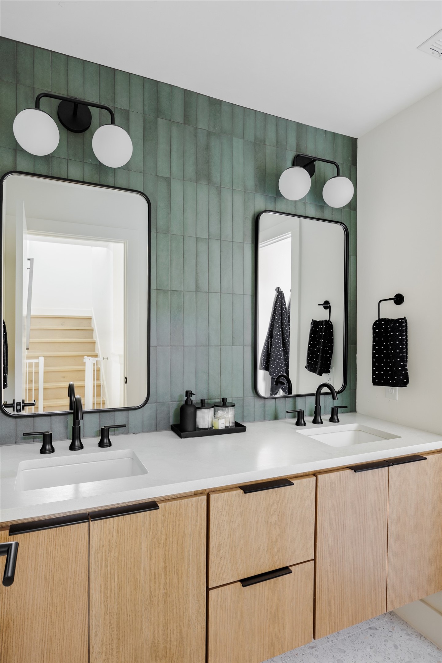 108 Comal Street Austin, TX 78702 - Photo 21 of 40 a bathroom with double vanity sink and a mirror
