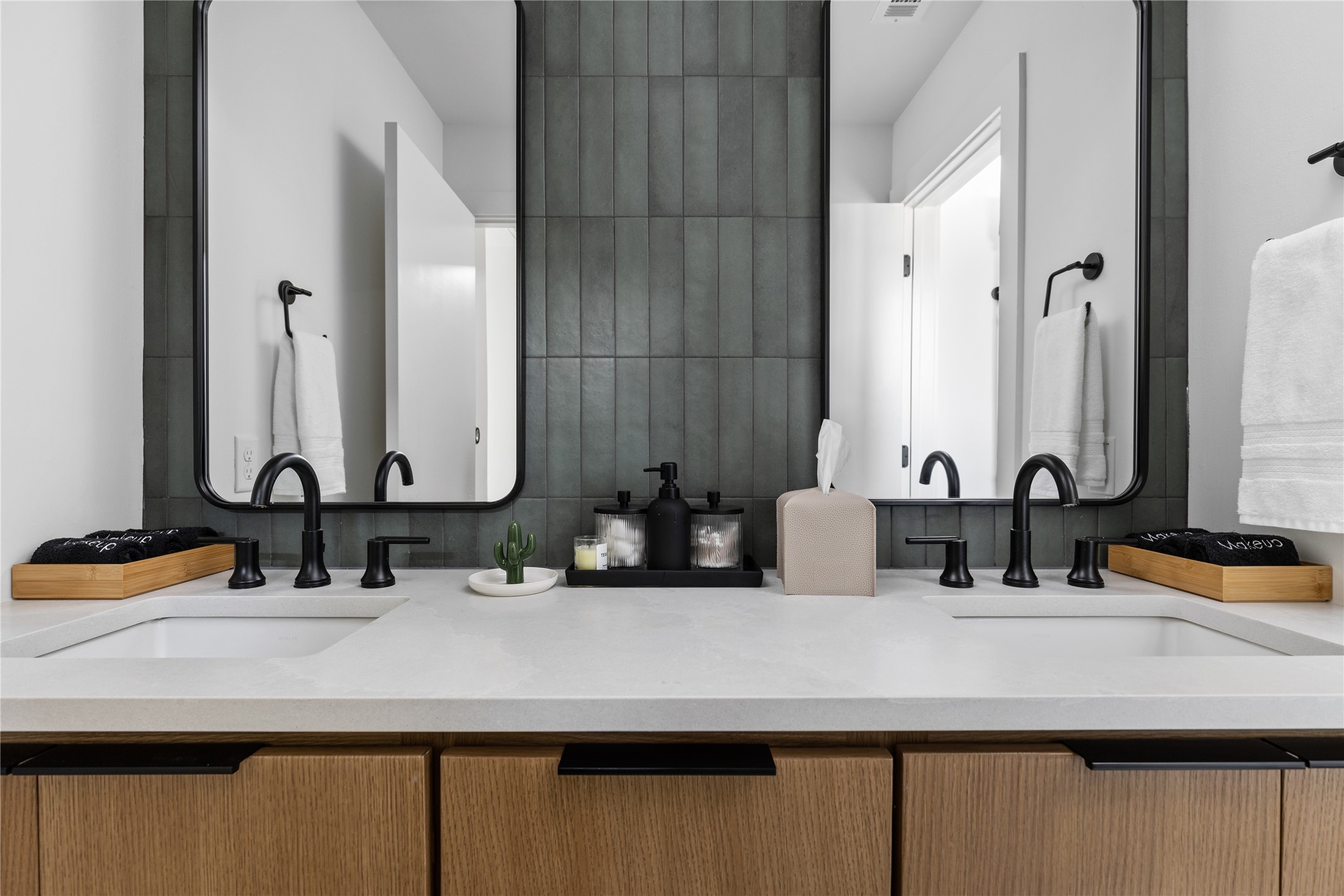 108 Comal Street Austin, TX 78702 - Photo 23 of 40 a bathroom with double vanity sinks and a mirror