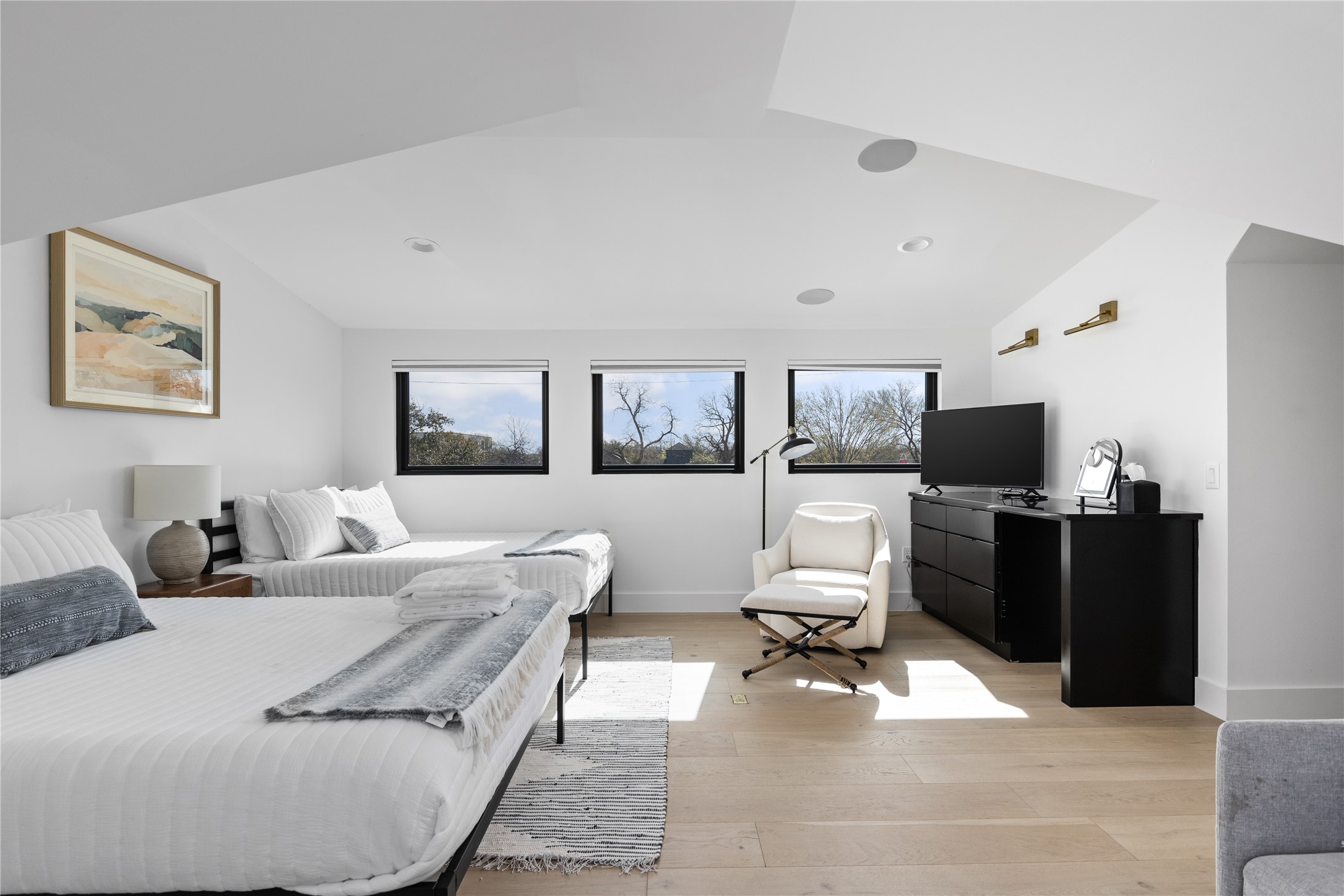 108 Comal Street Austin, TX 78702 - Photo 24 of 40 Bedroom with light wood-type flooring and lofted ceiling