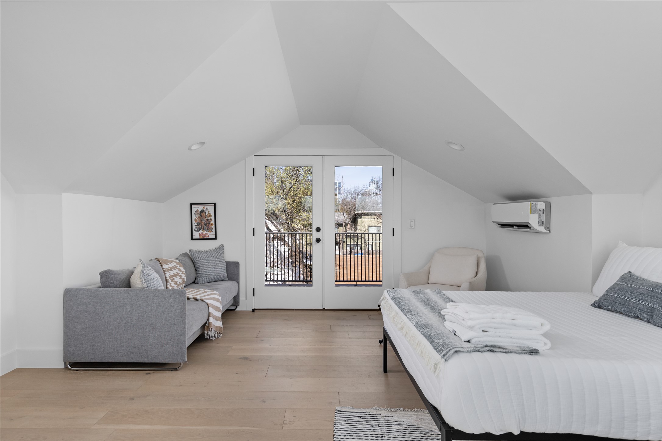 108 Comal Street Austin, TX 78702 - Photo 25 of 40 Bedroom featuring french doors, light wood-type flooring, and access to outside