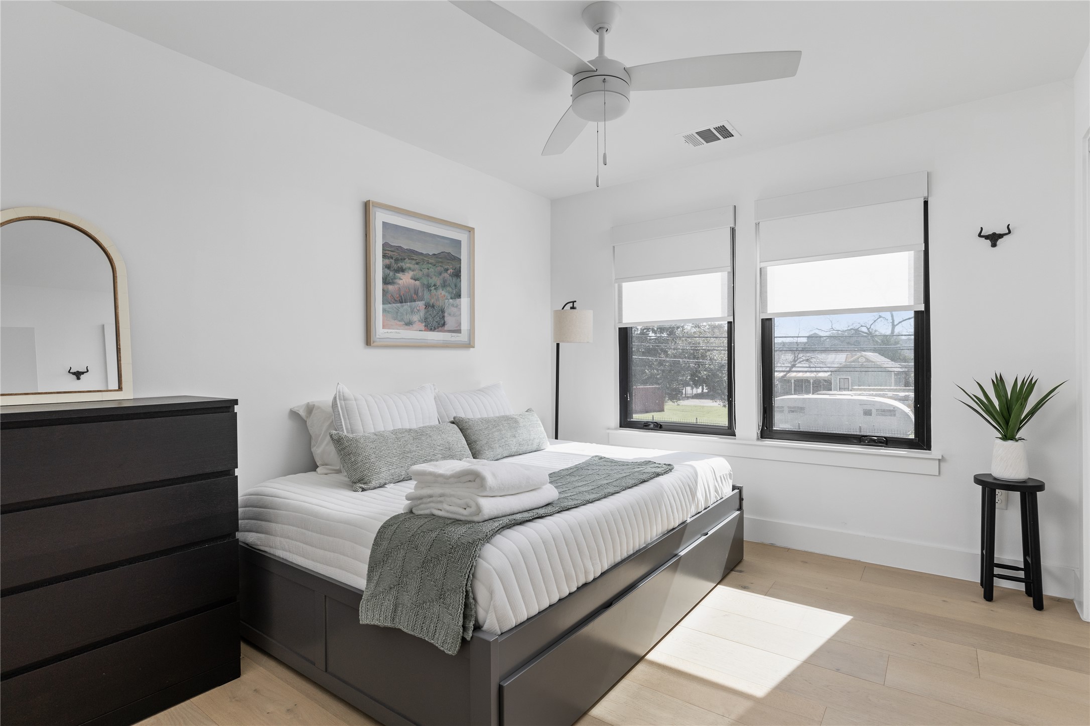 108 Comal Street Austin, TX 78702 - Photo 26 of 40 Bedroom featuring light wood finished floors and a ceiling fan