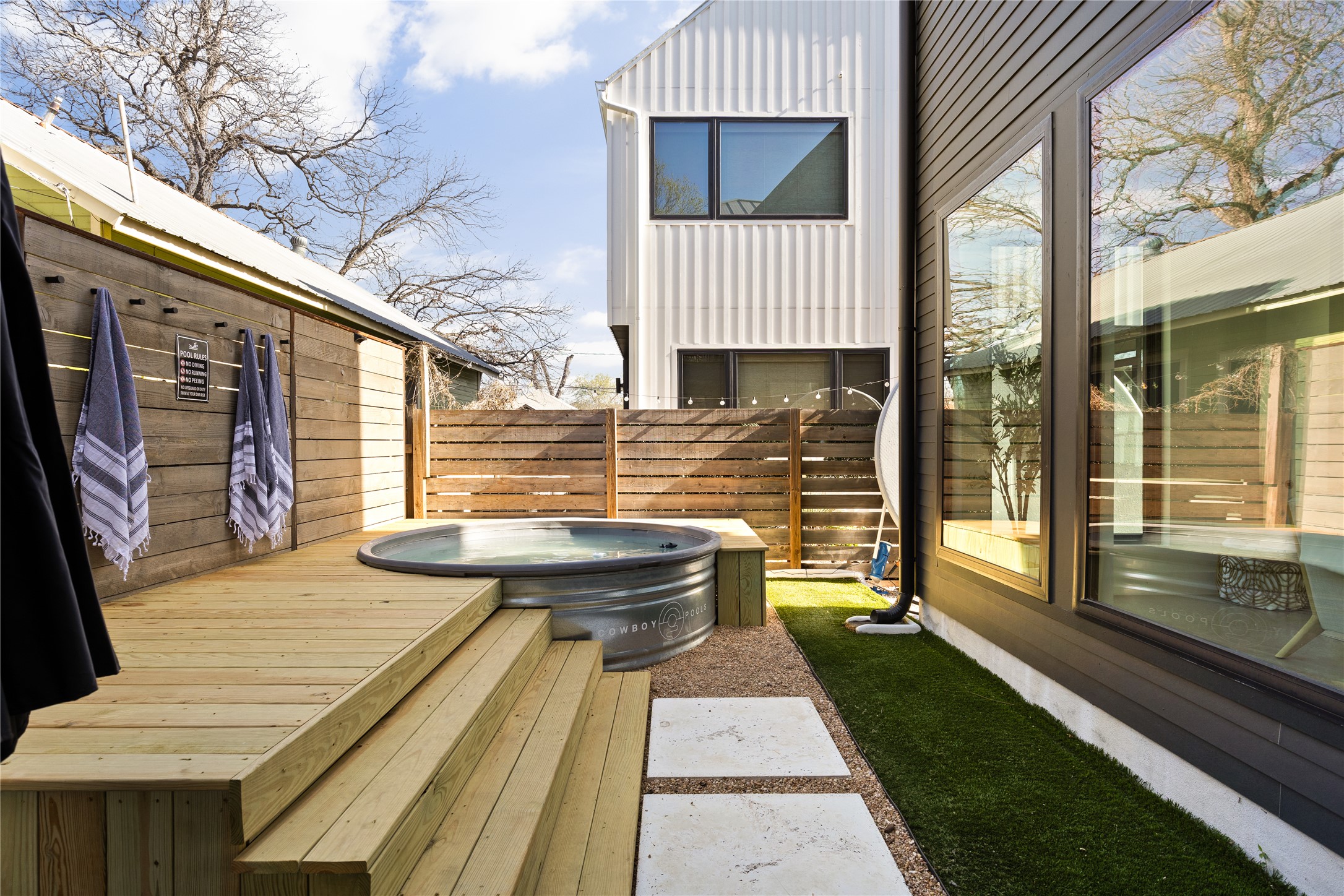 108 Comal Street Austin, TX 78702 - Photo 28 of 40 Deck with an outdoor hot tub and a patio