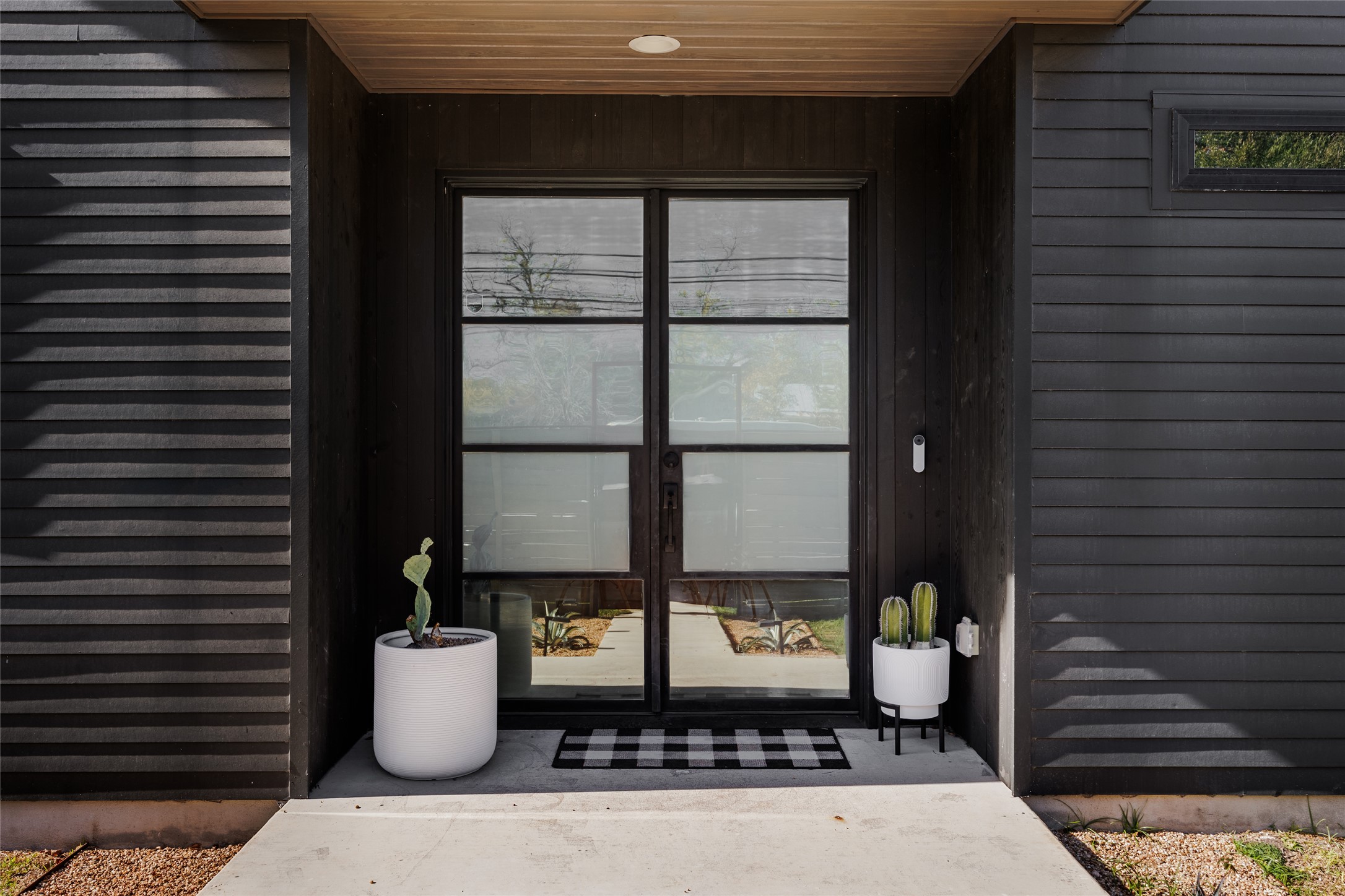 108 Comal Street Austin, TX 78702 - Photo 3 of 40 a table and chair in front of a door