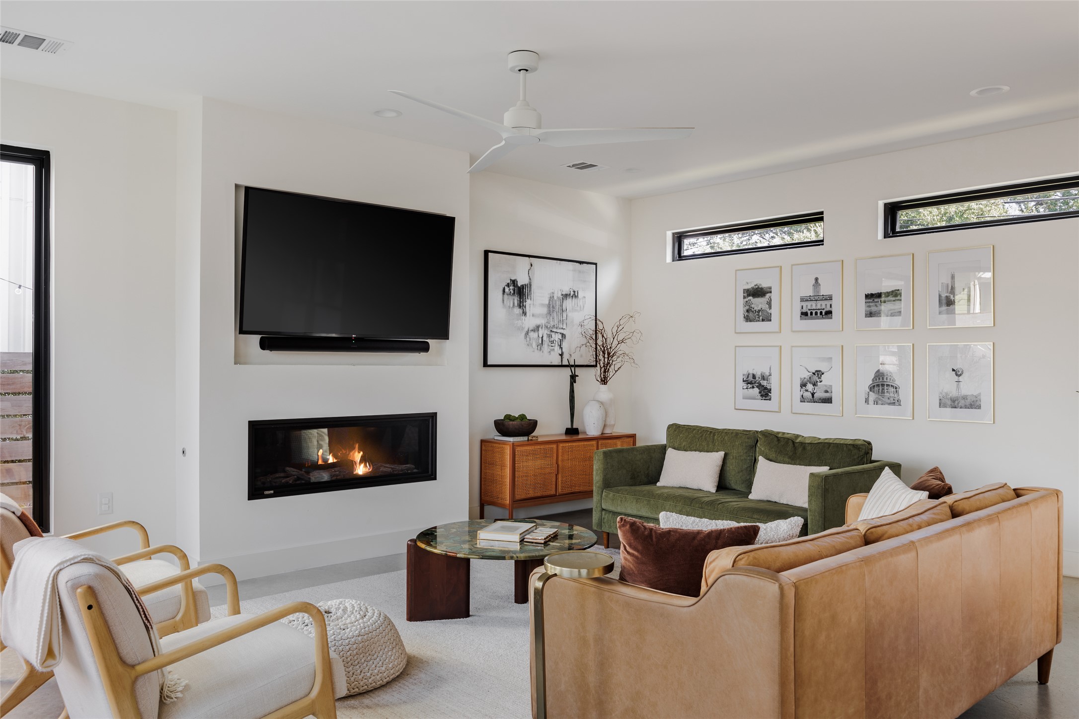 108 Comal Street Austin, TX 78702 - Photo 6 of 40 Living area featuring a glass covered fireplace and a ceiling fan