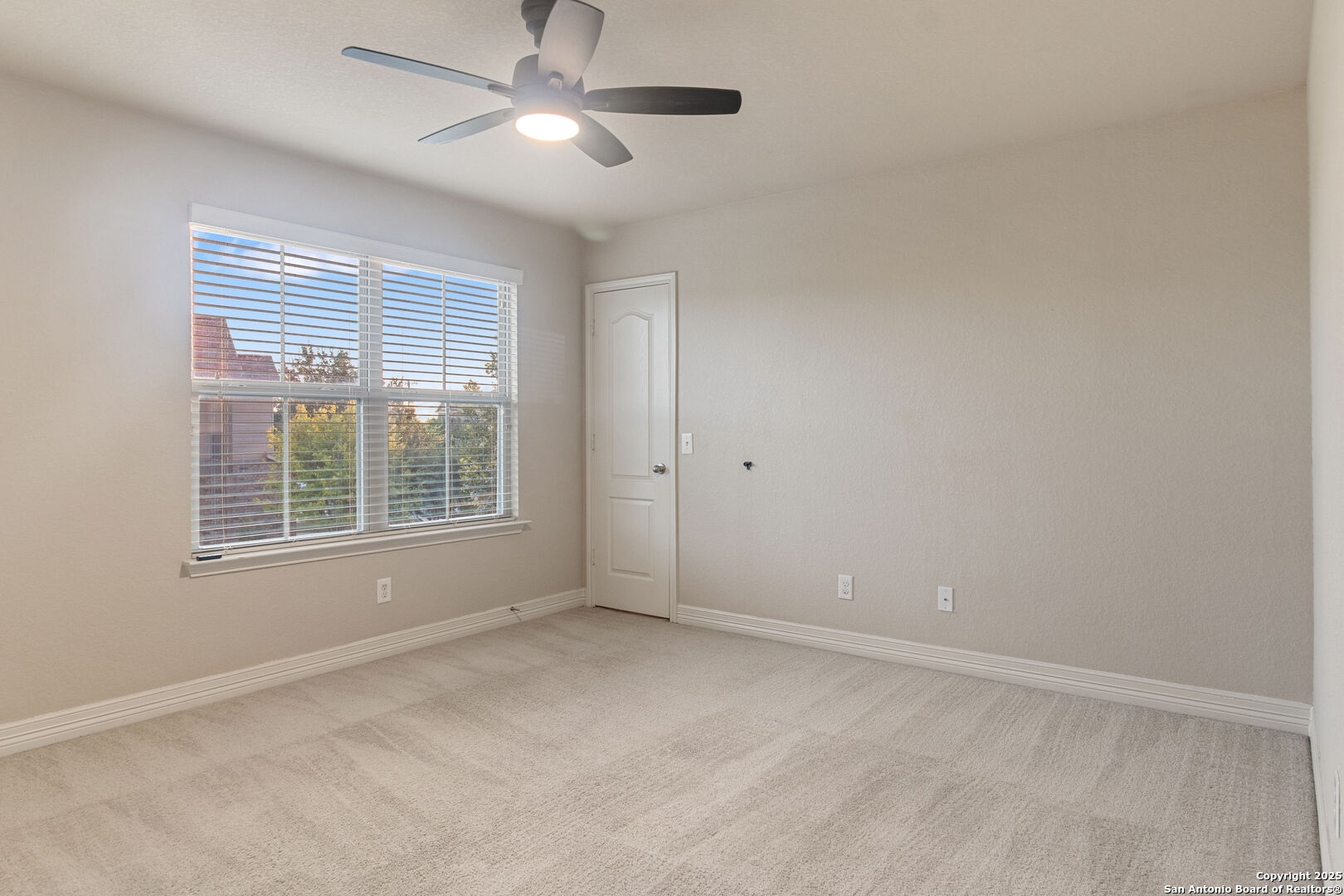 8806 Atwater Creek San Antonio, TX 78245 - Photo 11 of 16 a view of an empty room with a window