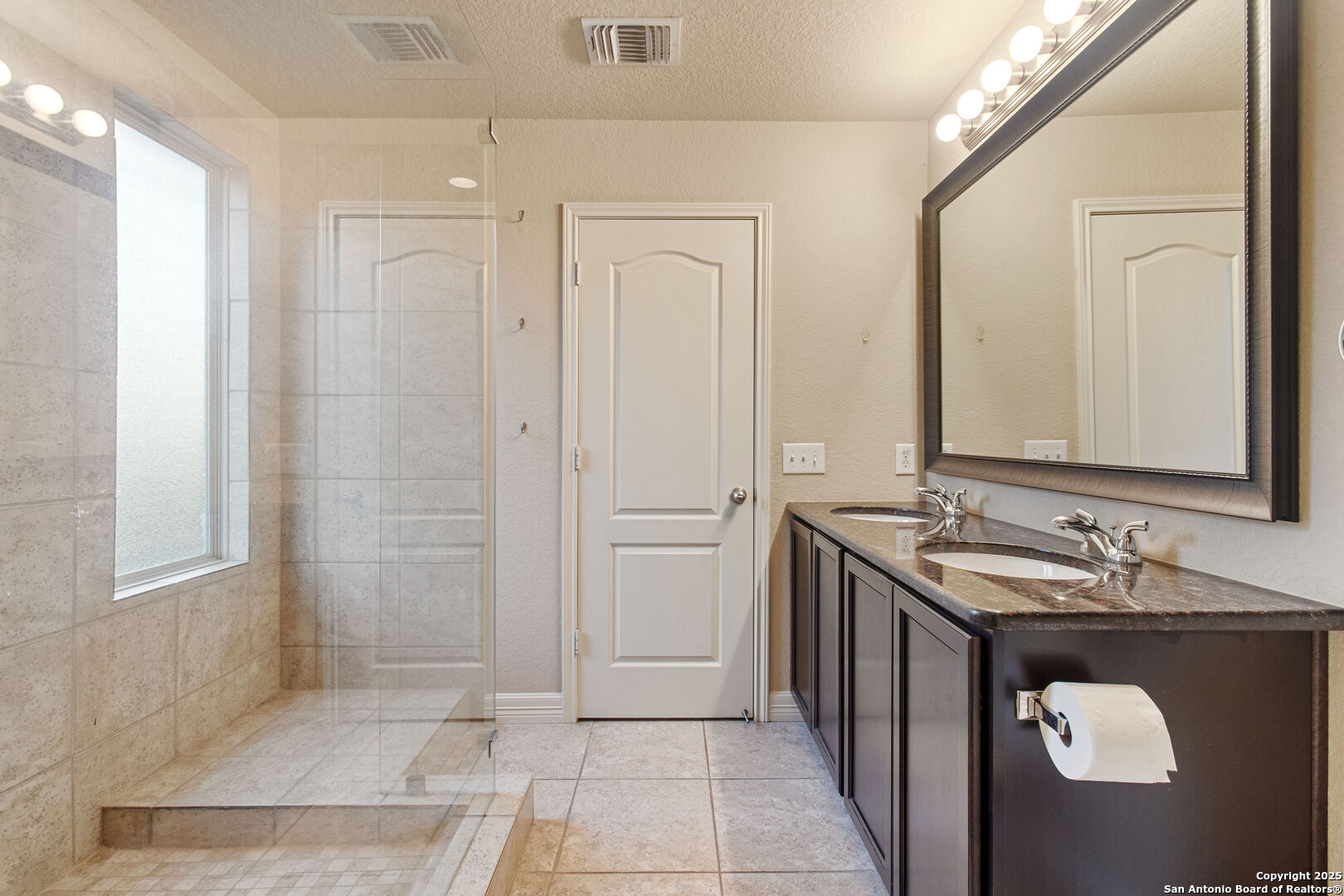 8806 Atwater Creek San Antonio, TX 78245 - Photo 14 of 16 a bathroom with a sink and a mirror