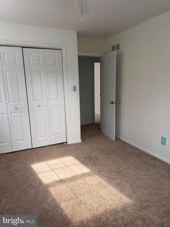 a view of an empty room and entryway