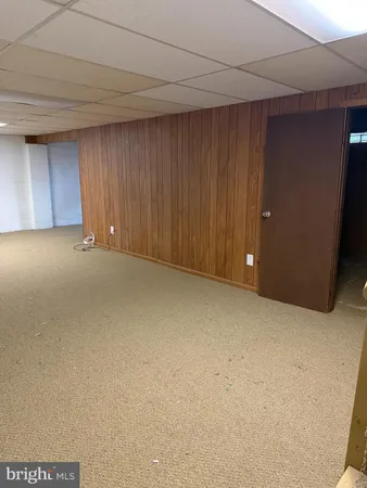 a view of an empty room and a window