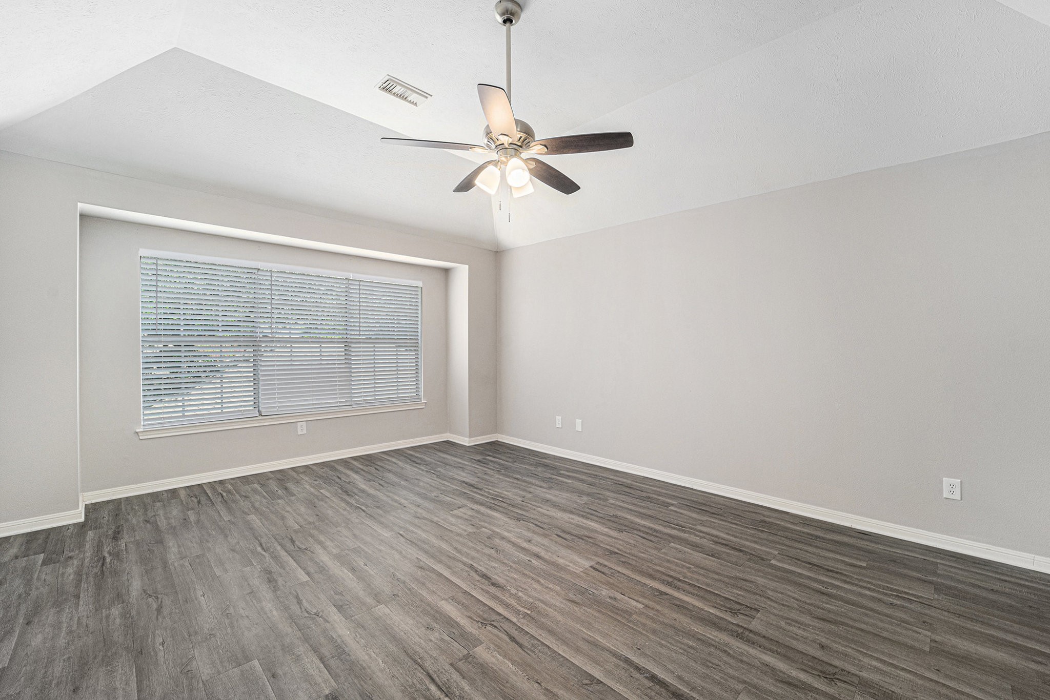 15906 Marwick Court Houston, TX 77095 - Photo 14 of 23 wooden floor in an empty room with a window