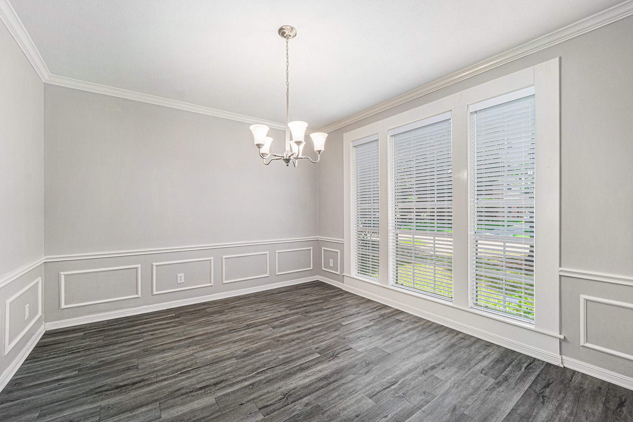 15906 Marwick Court Houston, TX 77095 - Photo 6 of 23 a view of an empty room with wooden floor and a window