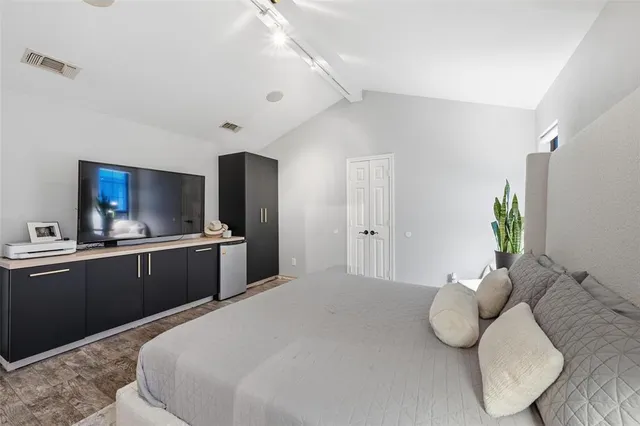 a large white bed in a white room