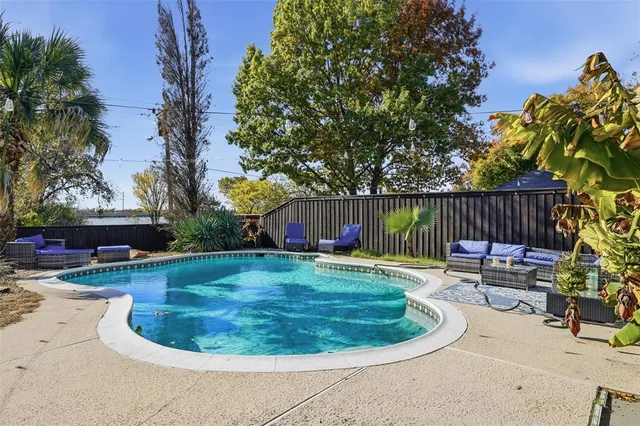 a view of swimming pool having patio