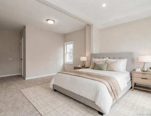 a bedroom with a bed and a night lamp