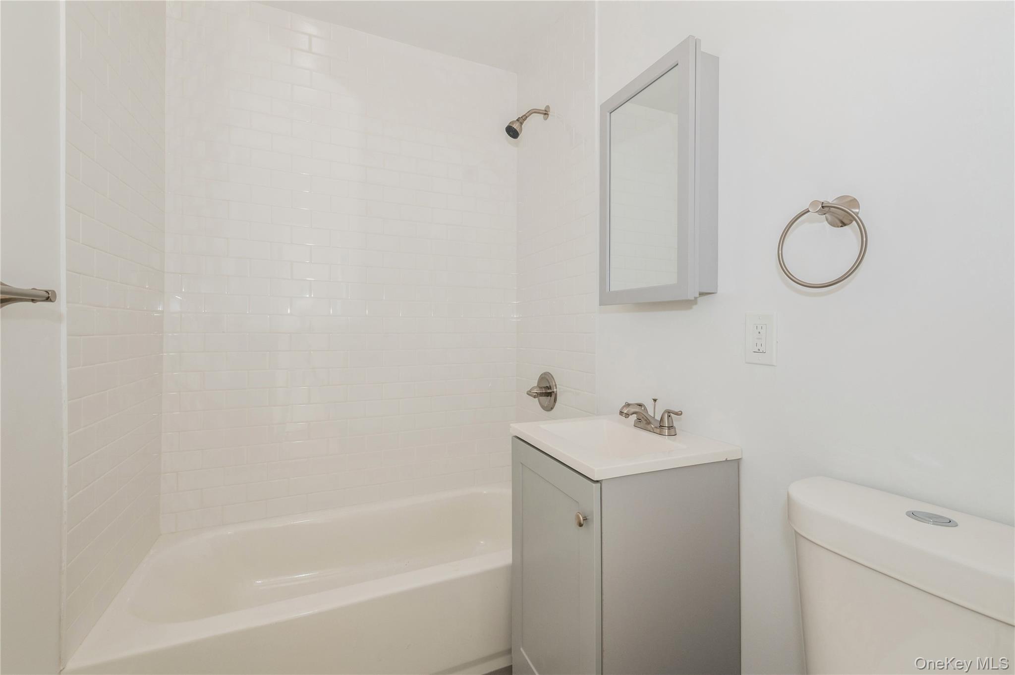 216-23 136th Road Queens, NY 11413 - Photo 7 of 28 Full bathroom with shower combination and vanity