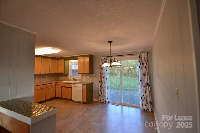 a kitchen with a stove a sink and a refrigerator