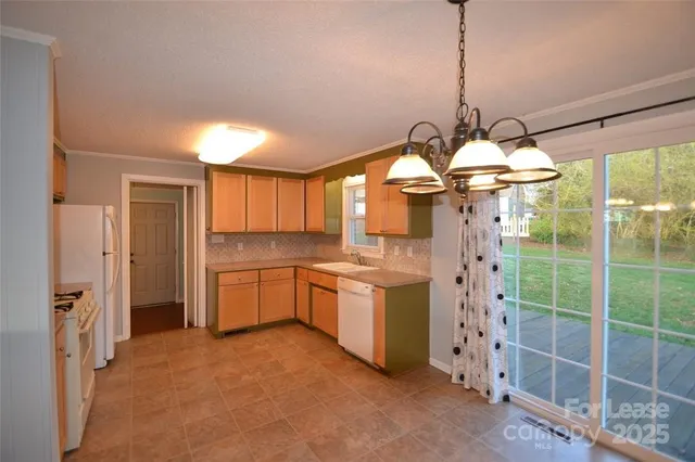 a kitchen that has a lot of stainless steel appliances
