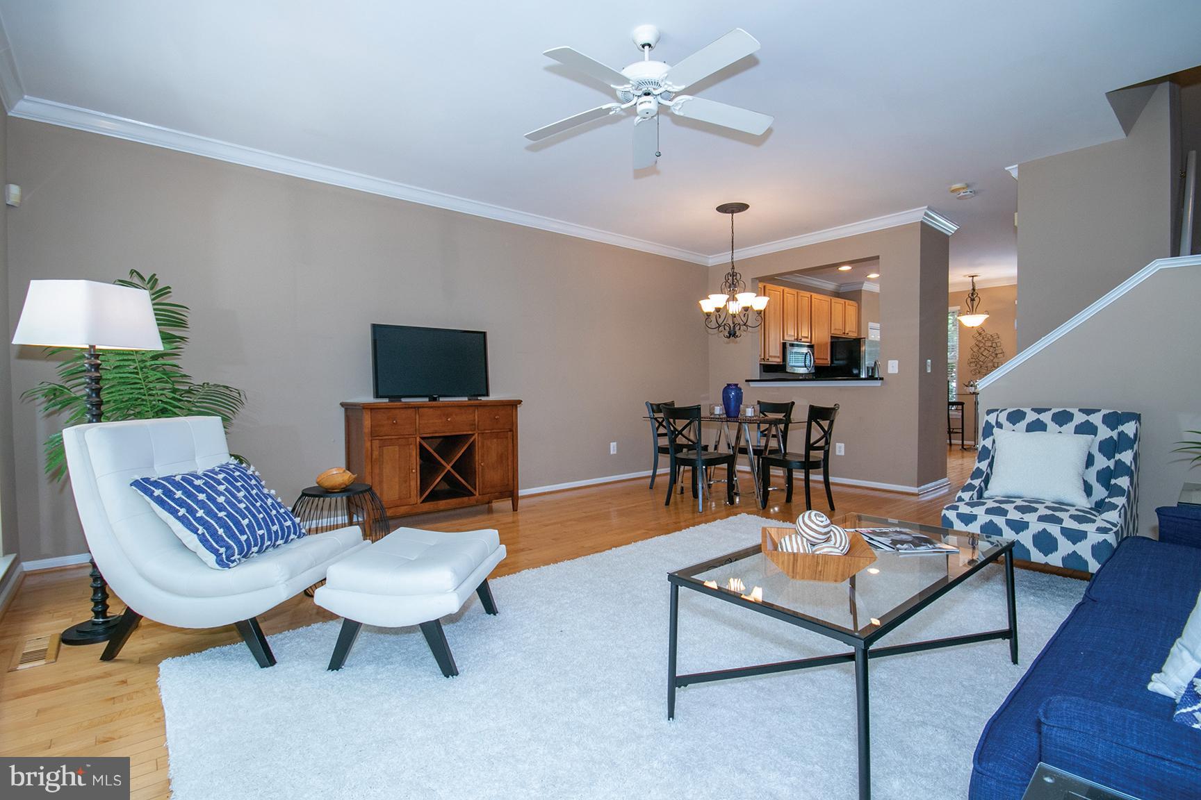 1301 Vintage Place Reston, VA 20194 - Photo 12 of 40 Open concept living room to dining area