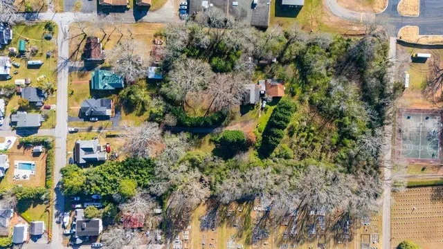 an aerial view of residential houses with swimming pool