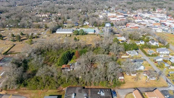 an aerial view of residential house with outdoor space