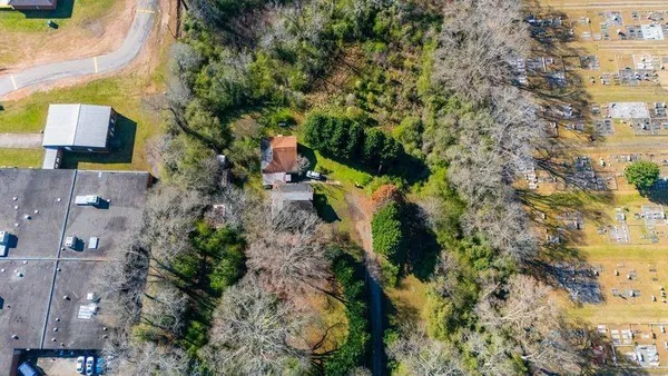 an aerial view of residential houses with outdoor space