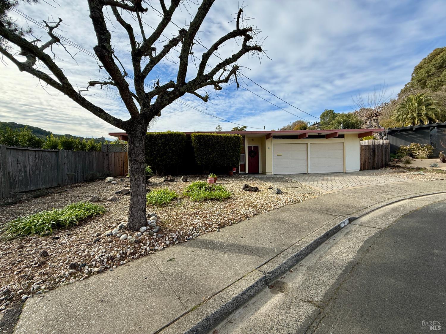 a backyard of a house with wooden fence