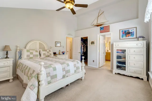 a bedroom with a bed and a view kitchen