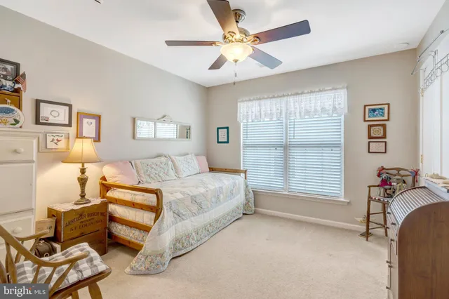 a spacious bedroom with a bed and a window