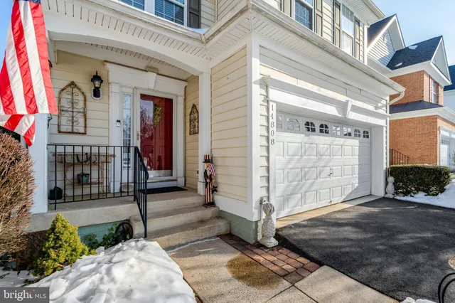 a view of front door of house with stairs