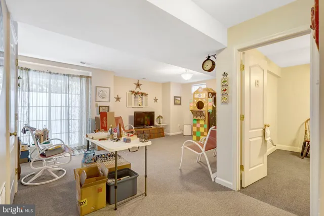 a view of a livingroom with furniture and a window