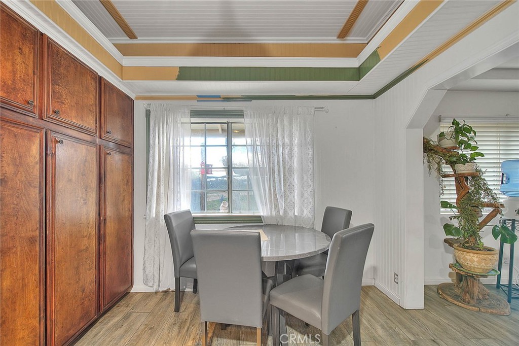 8529 Nielson Road Phelan, CA 92371 - Photo 11 of 44 a view of a dining room with furniture window and wooden floor