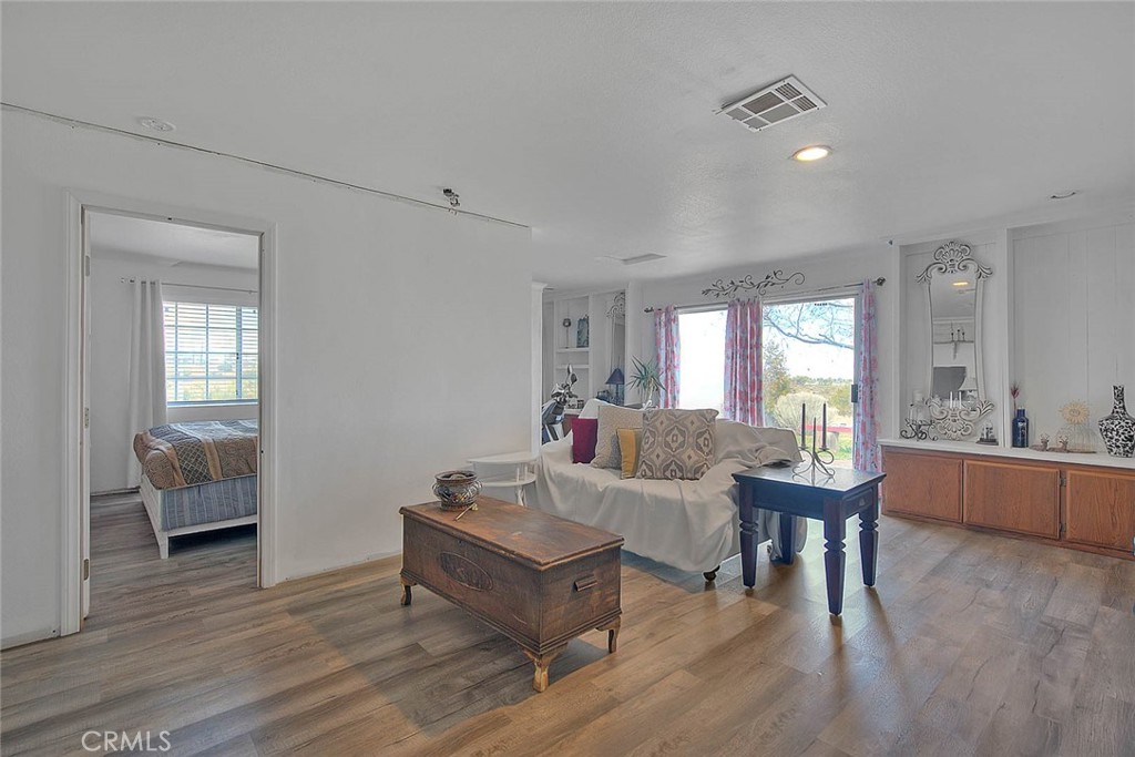 8529 Nielson Road Phelan, CA 92371 - Photo 12 of 44 a living room with furniture and a wooden floor