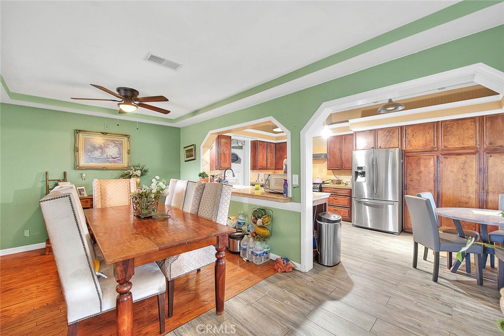 8529 Nielson Road Phelan, CA 92371 - Photo 14 of 44 a dining room with furniture a rug and wooden floor
