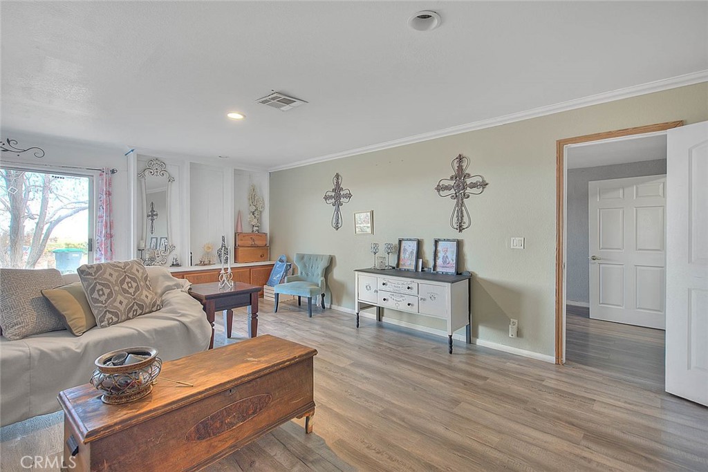 8529 Nielson Road Phelan, CA 92371 - Photo 16 of 44 a living room with furniture and a wooden floor