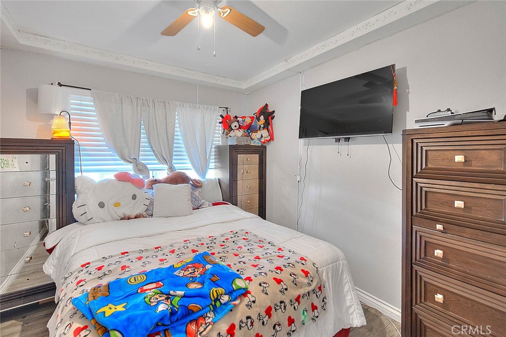 8529 Nielson Road Phelan, CA 92371 - Photo 24 of 44 a bedroom with a bed and a flat screen tv