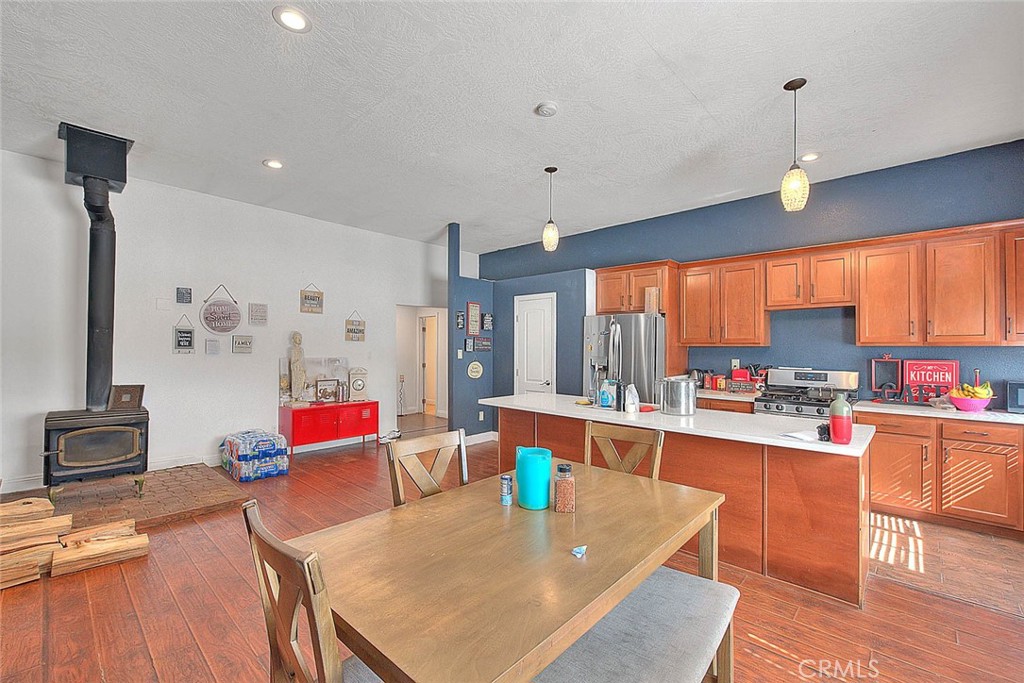 8529 Nielson Road Phelan, CA 92371 - Photo 27 of 44 a large kitchen with a table and chairs