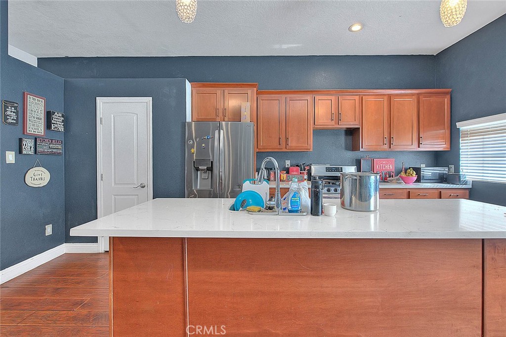 8529 Nielson Road Phelan, CA 92371 - Photo 29 of 44 a kitchen with a refrigerator and a window
