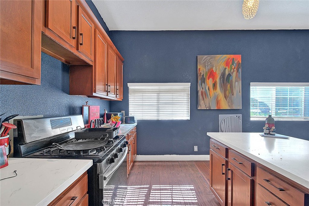 8529 Nielson Road Phelan, CA 92371 - Photo 30 of 44 a kitchen with a sink stove top oven and cabinets