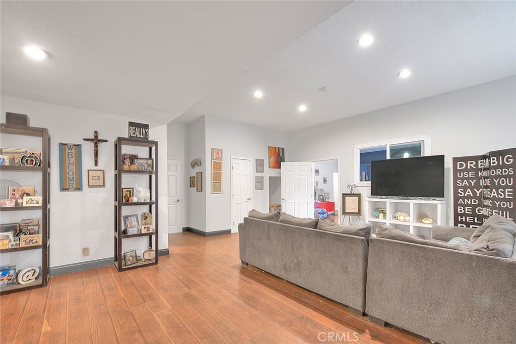 8529 Nielson Road Phelan, CA 92371 - Photo 32 of 44 a living room with furniture and a flat screen tv