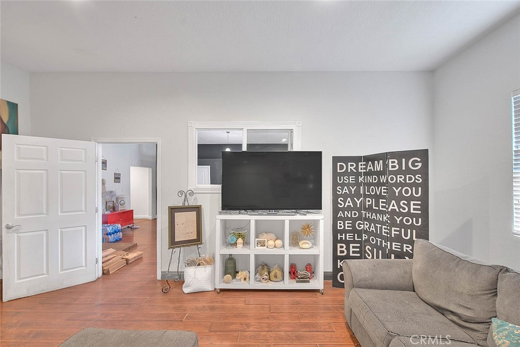 8529 Nielson Road Phelan, CA 92371 - Photo 33 of 44 a living room with furniture and a flat screen tv