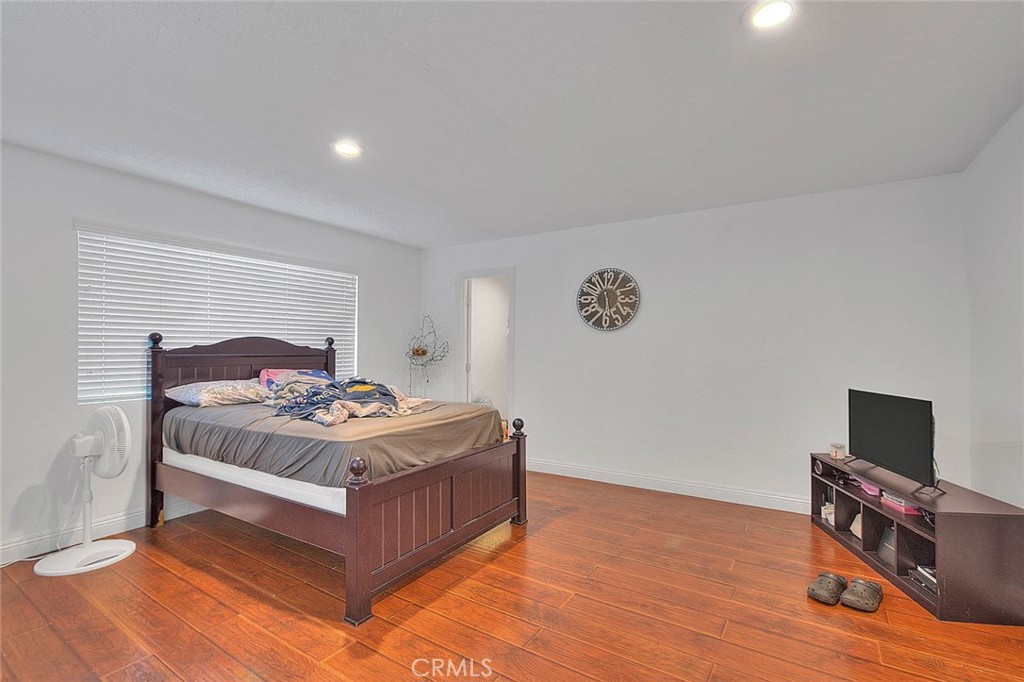 8529 Nielson Road Phelan, CA 92371 - Photo 35 of 44 a bedroom with a bed and a flat screen tv