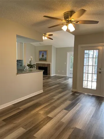 a view of a kitchen with a sink cabinet a kitchen island and a window