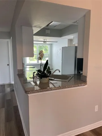 a view of a bathroom with a sink and mirror