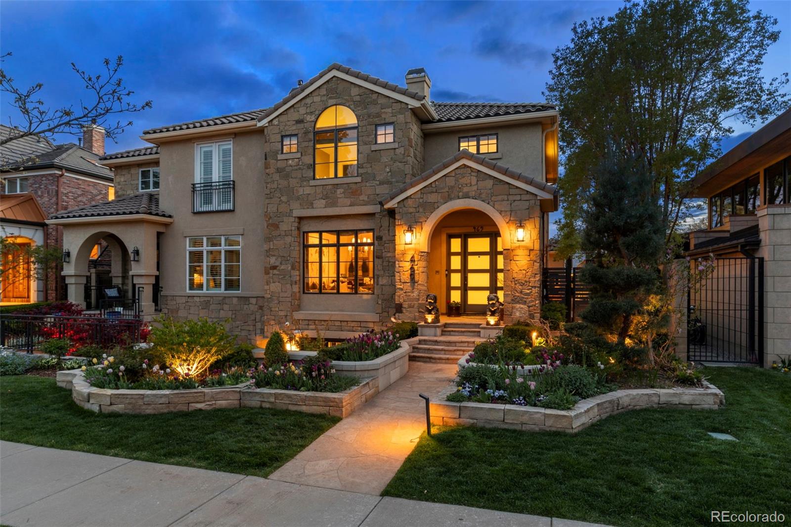 a front view of a house with garden