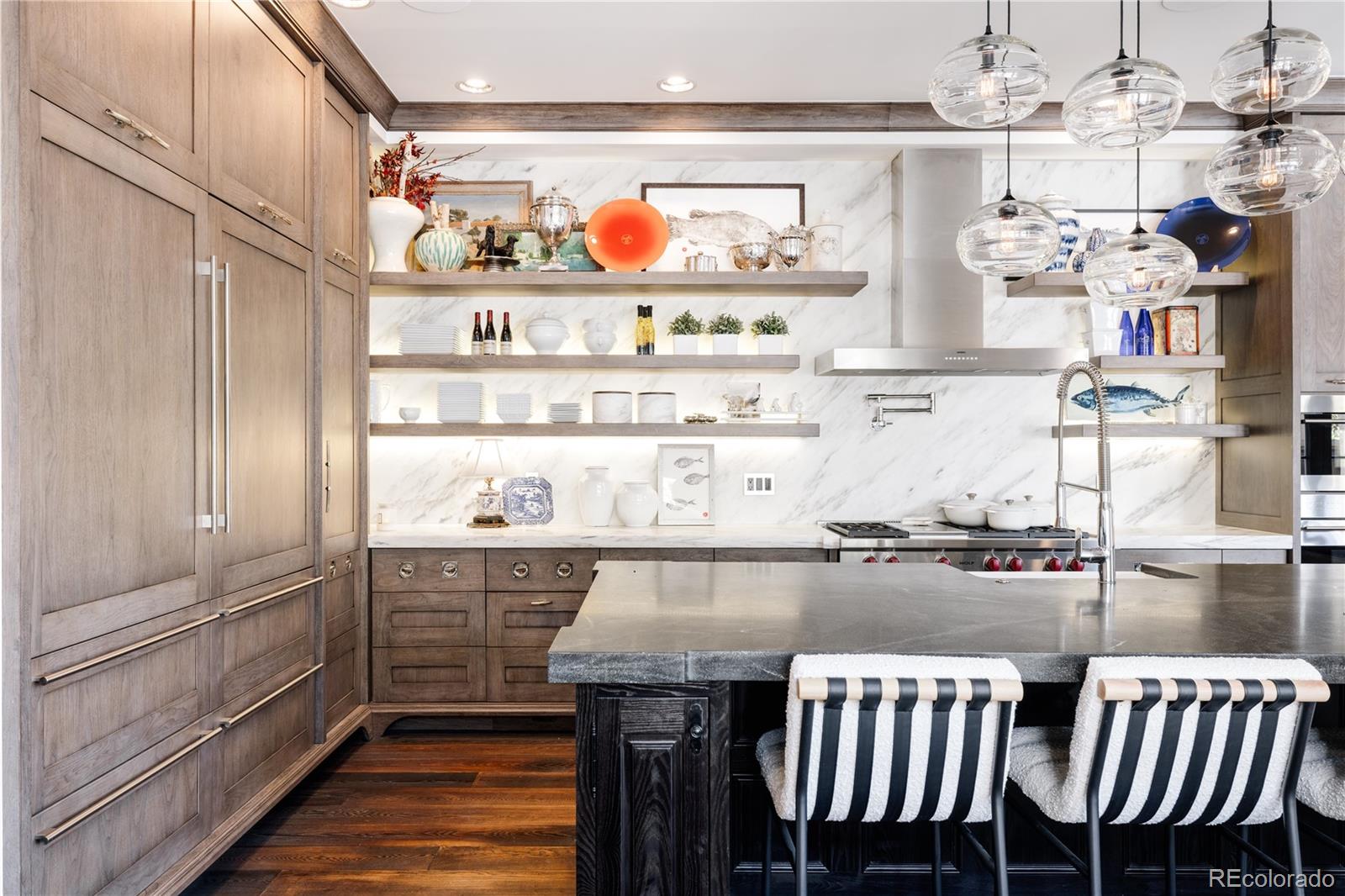 469 Cook Street Denver, CO 80206 - Photo 14 of 50 a kitchen with stainless steel appliances granite countertop a sink and cabinets