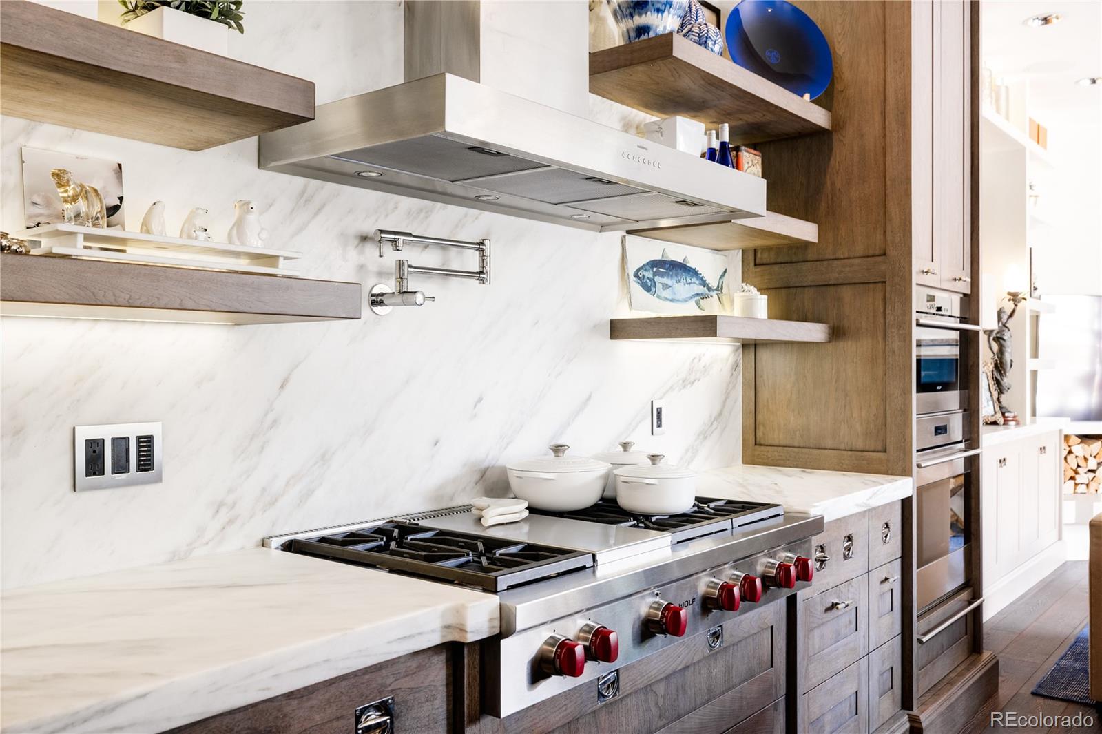 469 Cook Street Denver, CO 80206 - Photo 15 of 50 a stove top oven sitting inside of a kitchen