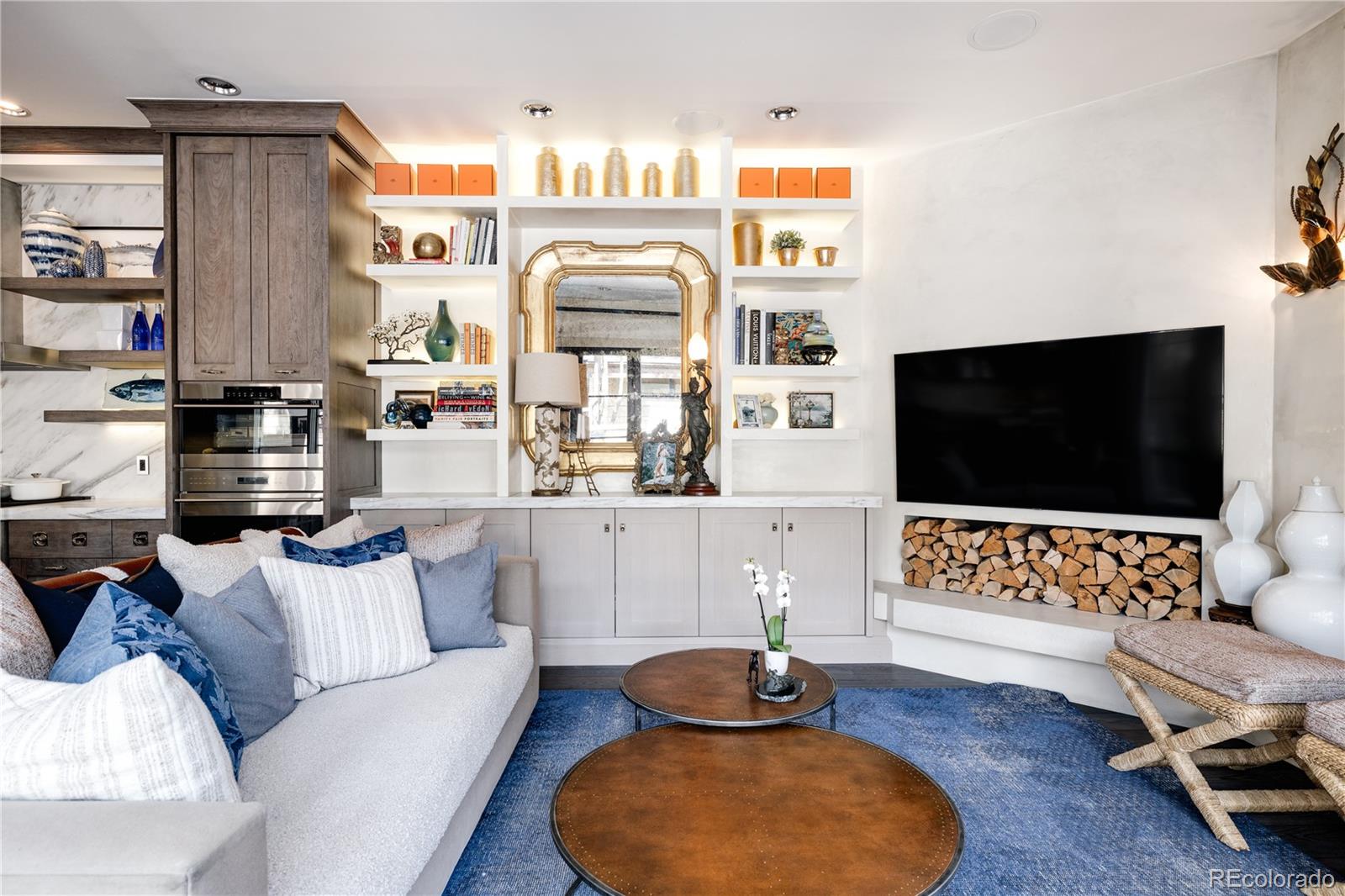 469 Cook Street Denver, CO 80206 - Photo 19 of 50 a living room with furniture and a flat screen tv